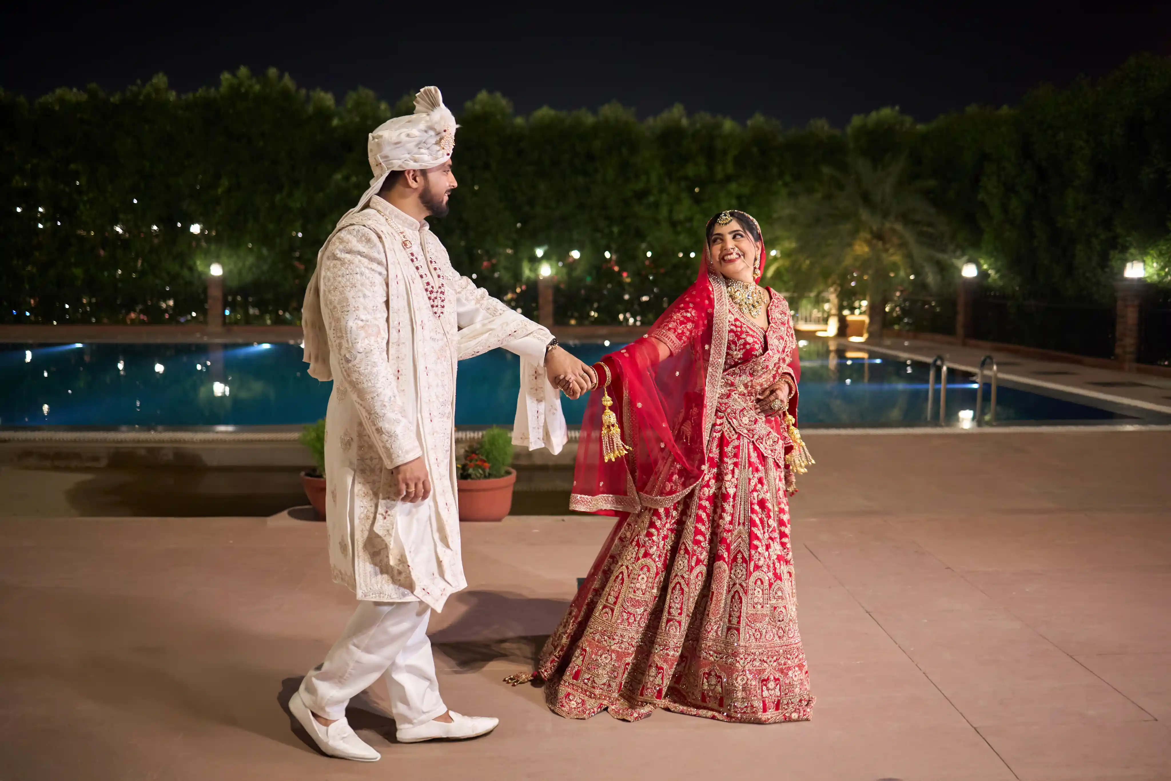 Wedding photography at The Village Lake Resort Varanasi - couple poolside portrait by The WeddingShoot